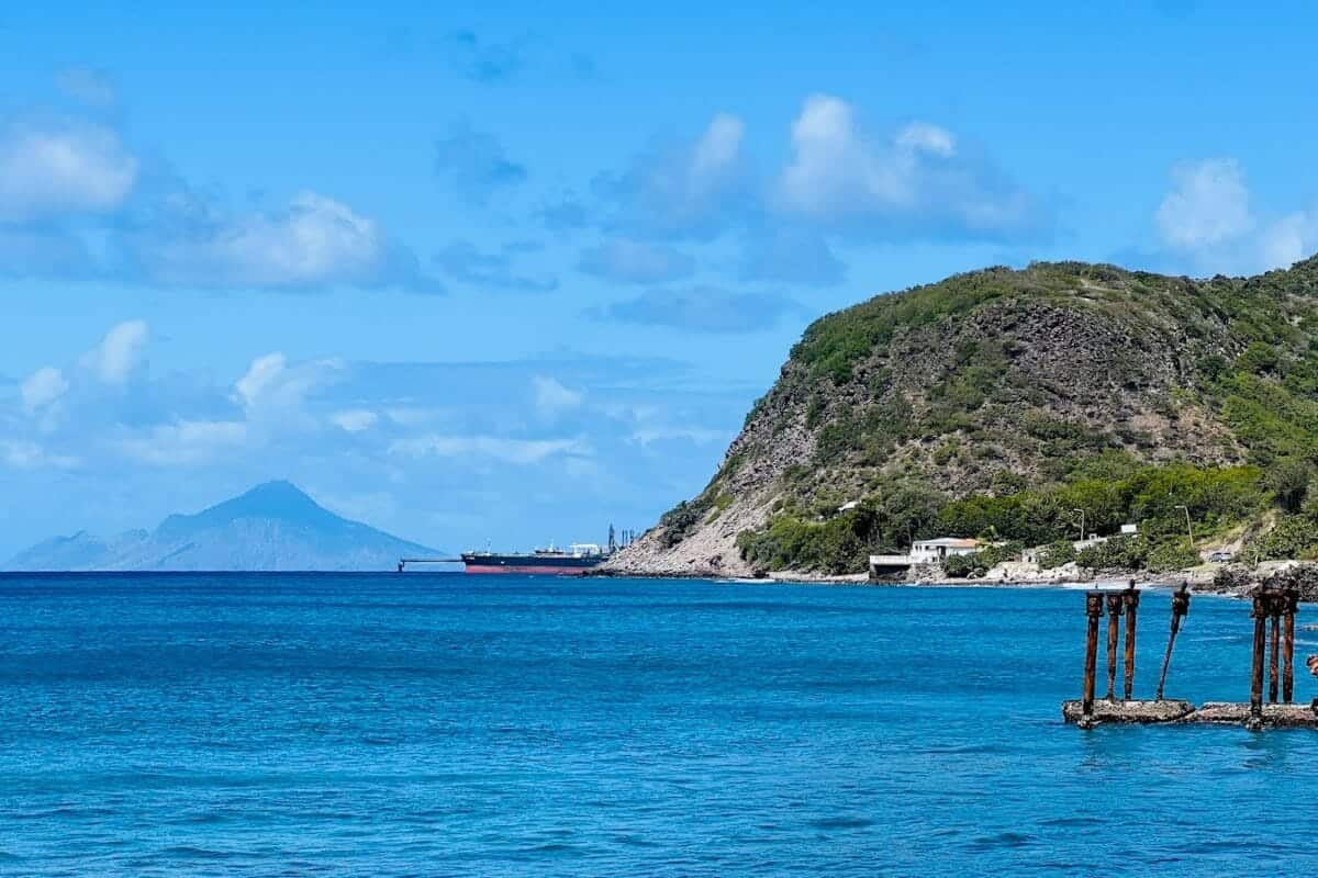 Sint Eustatius Travel Guide a body of water with a mountain in the background