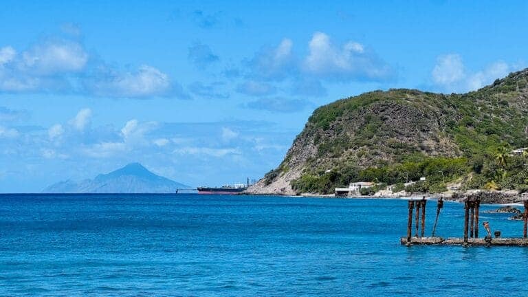 Sint Eustatius Travel Guide a body of water with a mountain in the background