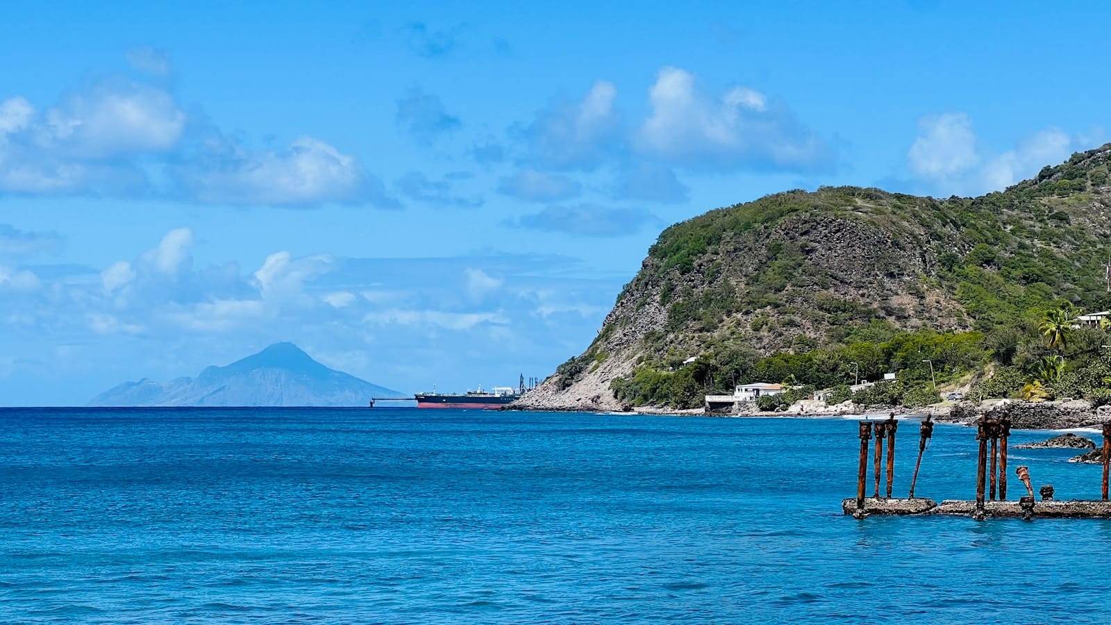 Sint Eustatius Travel Guide a body of water with a mountain in the background
