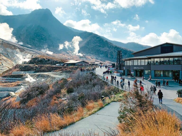 Hakone Travel Guide white and brown houses near mountain under white clouds during daytime