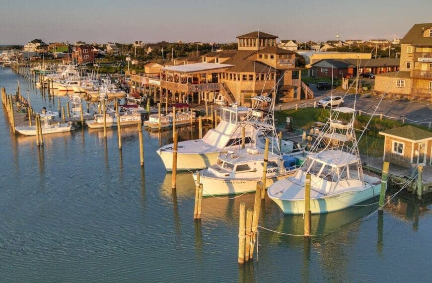 North Carolina Travel Guide white and blue boats on dock during daytime