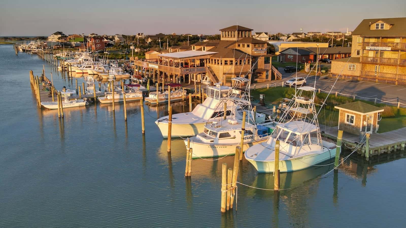 North Carolina Travel Guide white and blue boats on dock during daytime