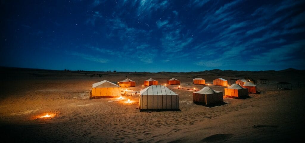 morocco travel guide white and brown tent on brown field under blue sky during night time