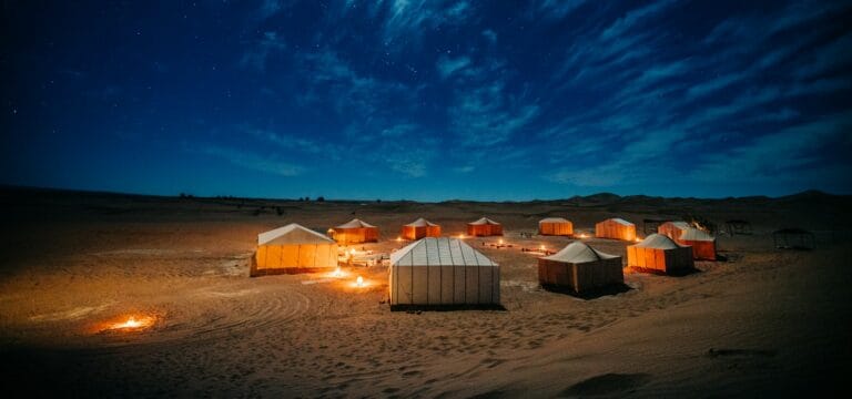 morocco travel guide white and brown tent on brown field under blue sky during night time