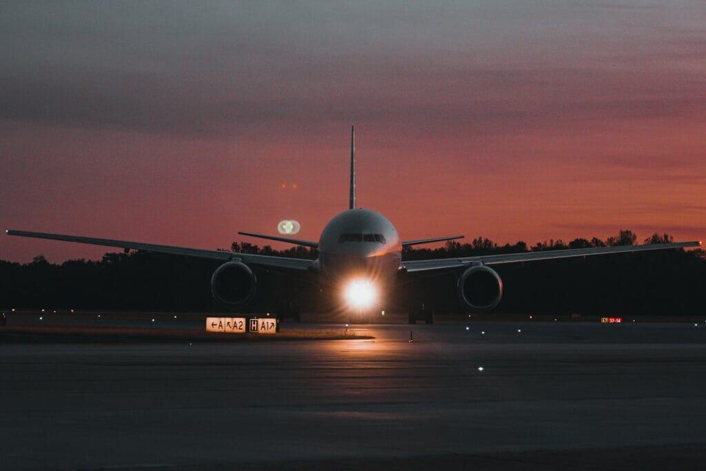 onetravel deals A large jetliner sitting on top of an airport tarmac