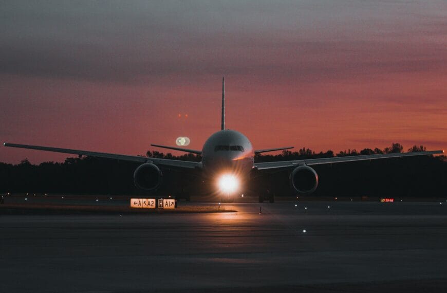 onetravel deals A large jetliner sitting on top of an airport tarmac