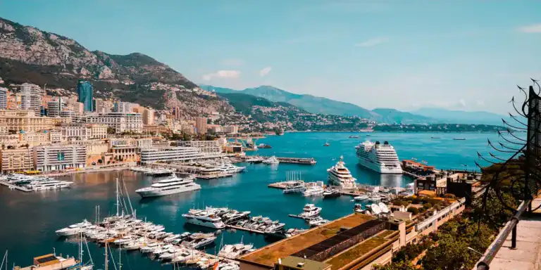 Monaco Travel Guide white and blue boat on sea during daytime