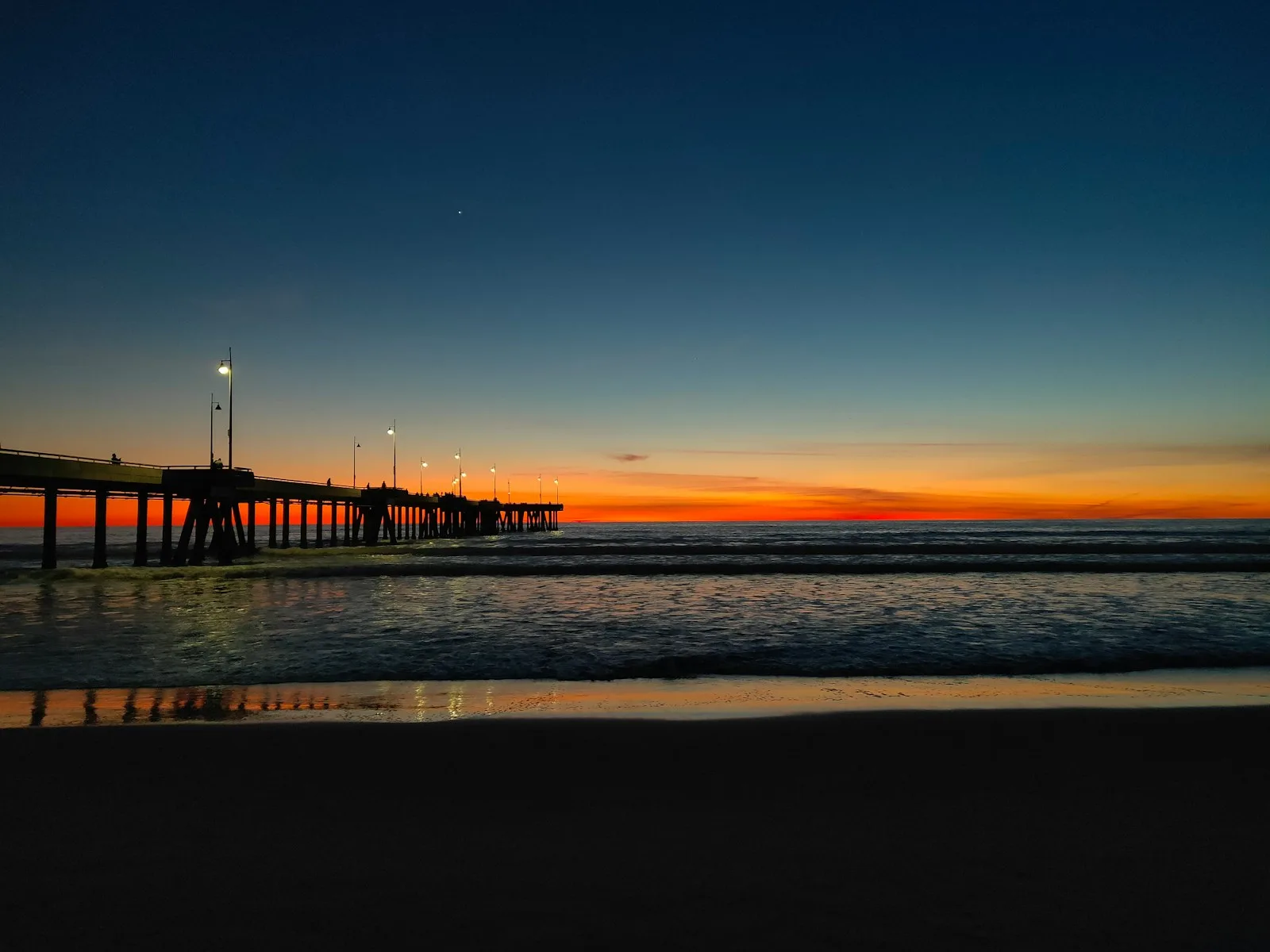 California Travel Guide silhouette of bridge on sea during sunset
