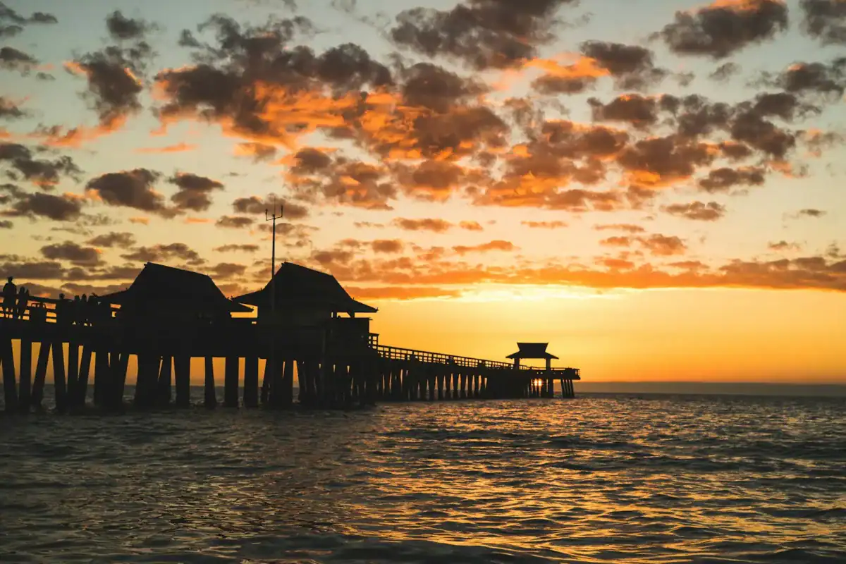 Naples Travel Guide silhouette of dock during golden hour