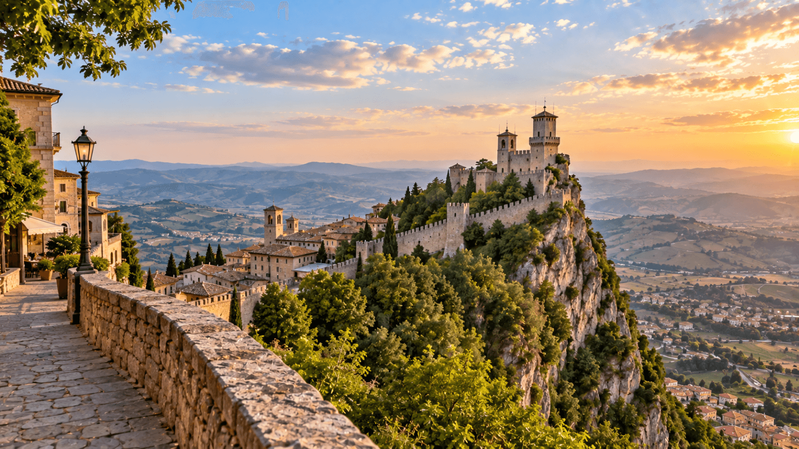 Medieval fortress towers rise above San Marino on Mount Titano, overlooking rolling countryside and distant mountains.