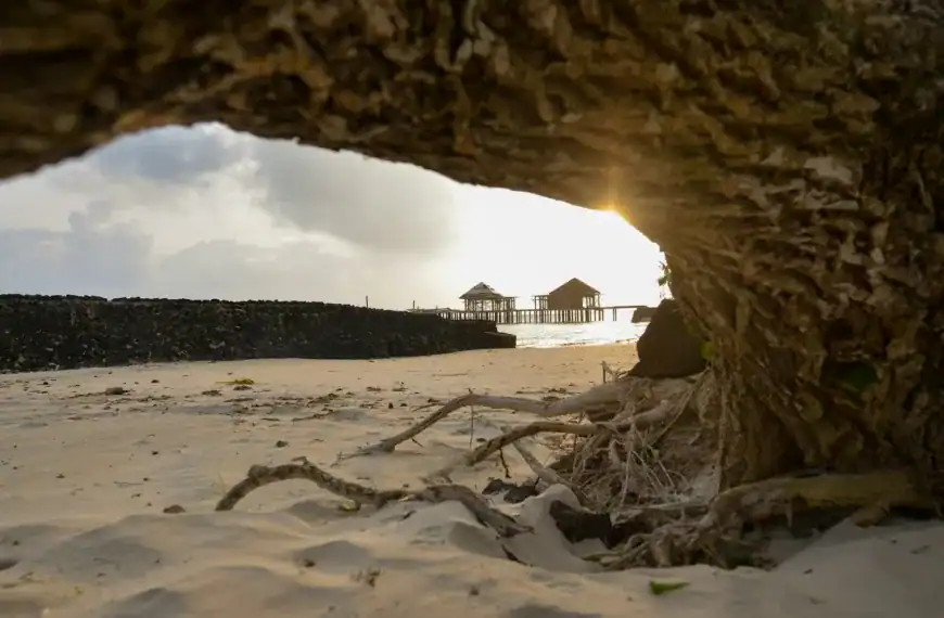 Samoa Travel Guide brown wooden house on white sand under white clouds during daytime