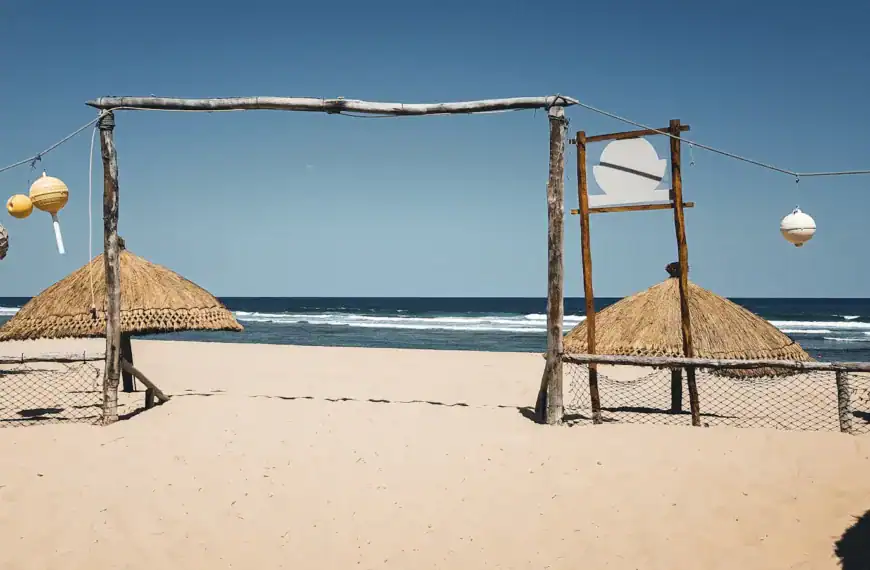 Mozambique Tours brown wooden beach house on white sand beach during daytime
