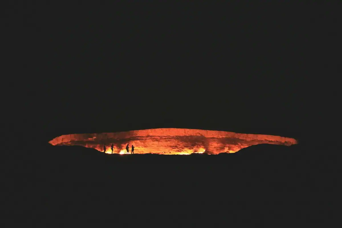 Turkmenistan Travel Guide photography of people near cave at night time