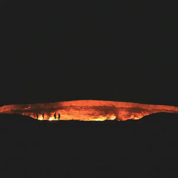 Turkmenistan Travel Guide photography of people near cave at night time