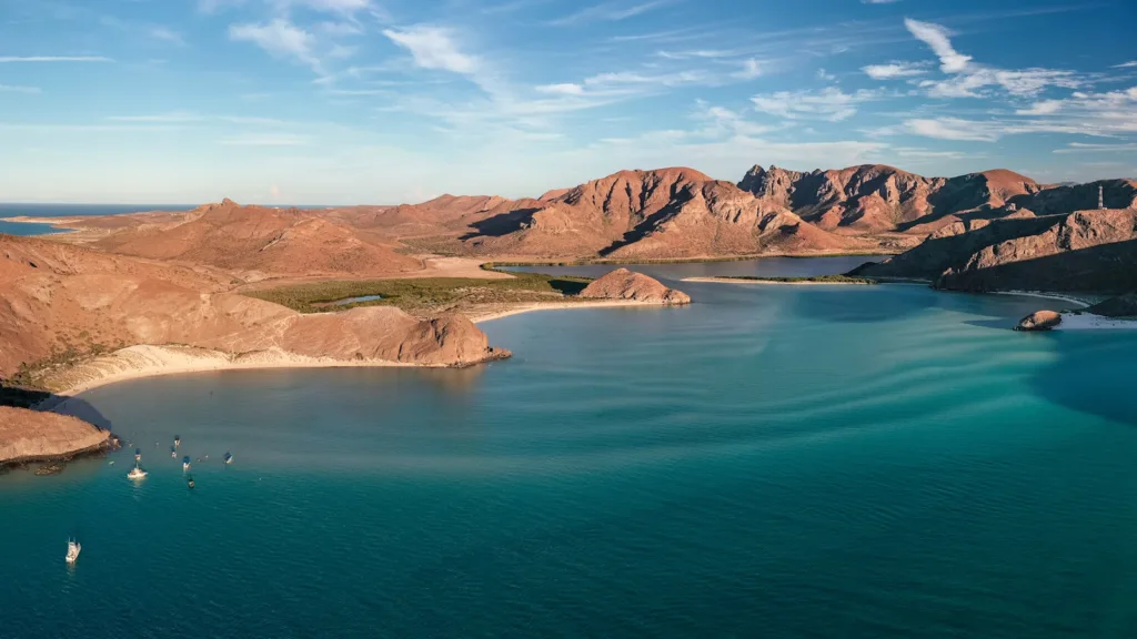 Baja California Travel Guide a body of water with mountains in the background