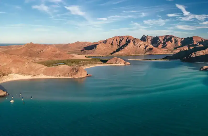Baja California Travel Guide a body of water with mountains in the background