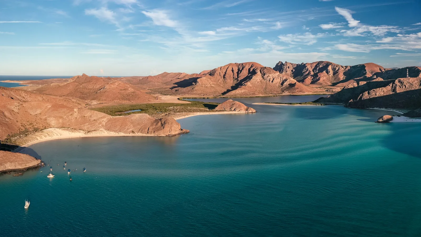 Baja California Travel Guide a body of water with mountains in the background