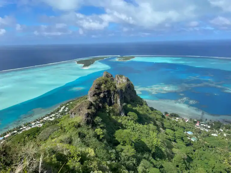 Tahiti Travel Guide a small island surrounded by water and trees