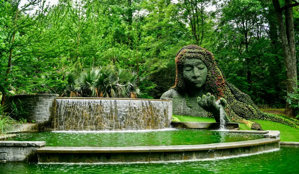 Georgia USA Tours a statue of a woman is in the middle of a pond