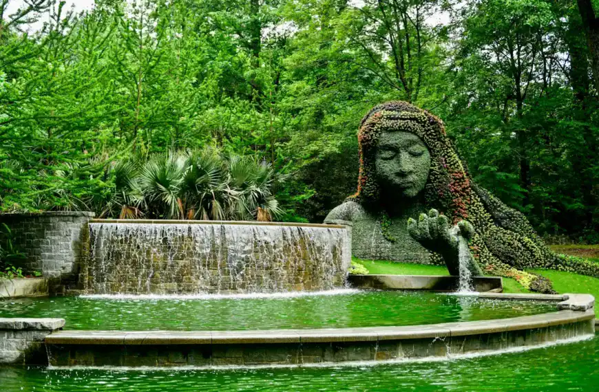 Georgia USA Tours a statue of a woman is in the middle of a pond