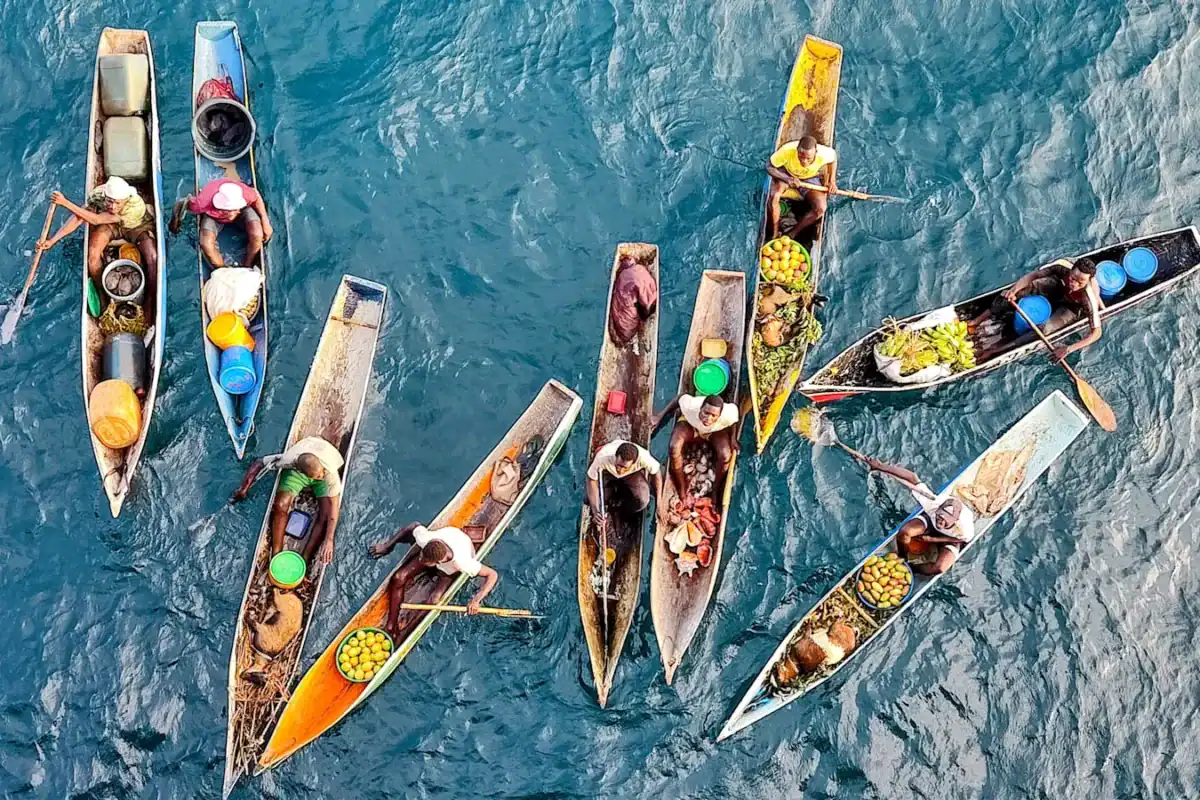 Mozambique Travel Guide a group of boats floating on top of a body of water