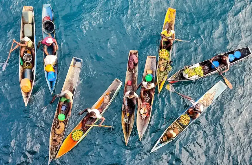 Mozambique Travel Guide a group of boats floating on top of a body of water