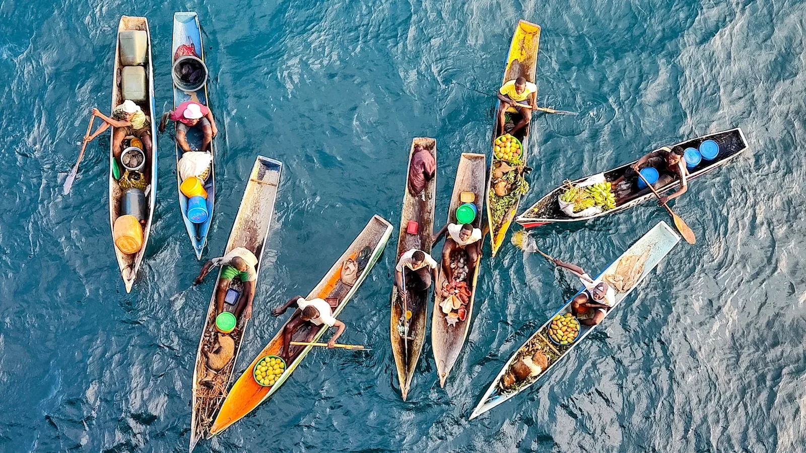 Mozambique Travel Guide a group of boats floating on top of a body of water