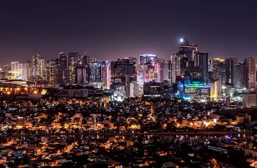 manila travel guide city with high rise buildings during night time