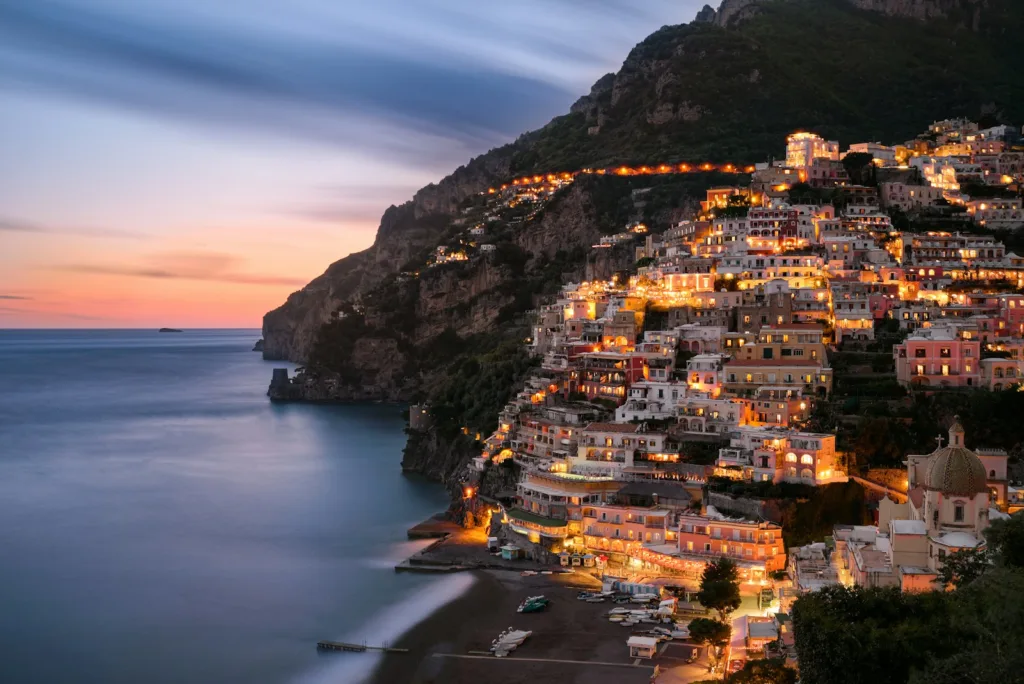 Amalfi Coast Travel Guide city buildings on mountain near body of water during daytime
