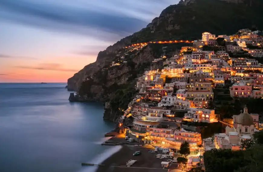 Amalfi Coast Travel Guide city buildings on mountain near body of water during daytime