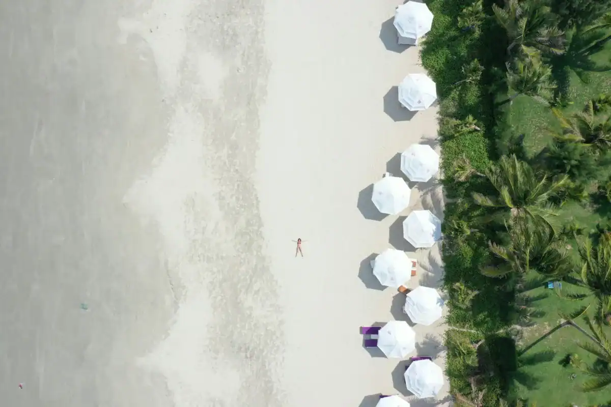 Beach Escapes white and blue balloons on white sand