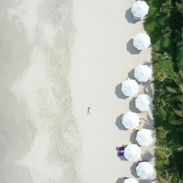 Beach Escapes white and blue balloons on white sand