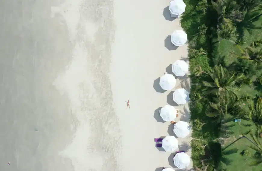Beach Escapes white and blue balloons on white sand