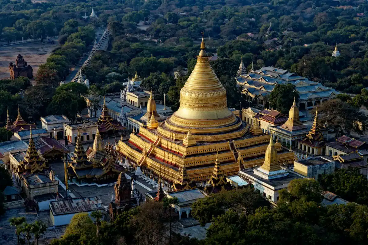 Myanmar Travel Guide brown and white concrete building near green trees during daytime