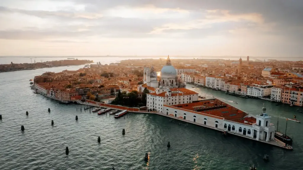 Venice tours white and brown dome building near body of water during daytime
