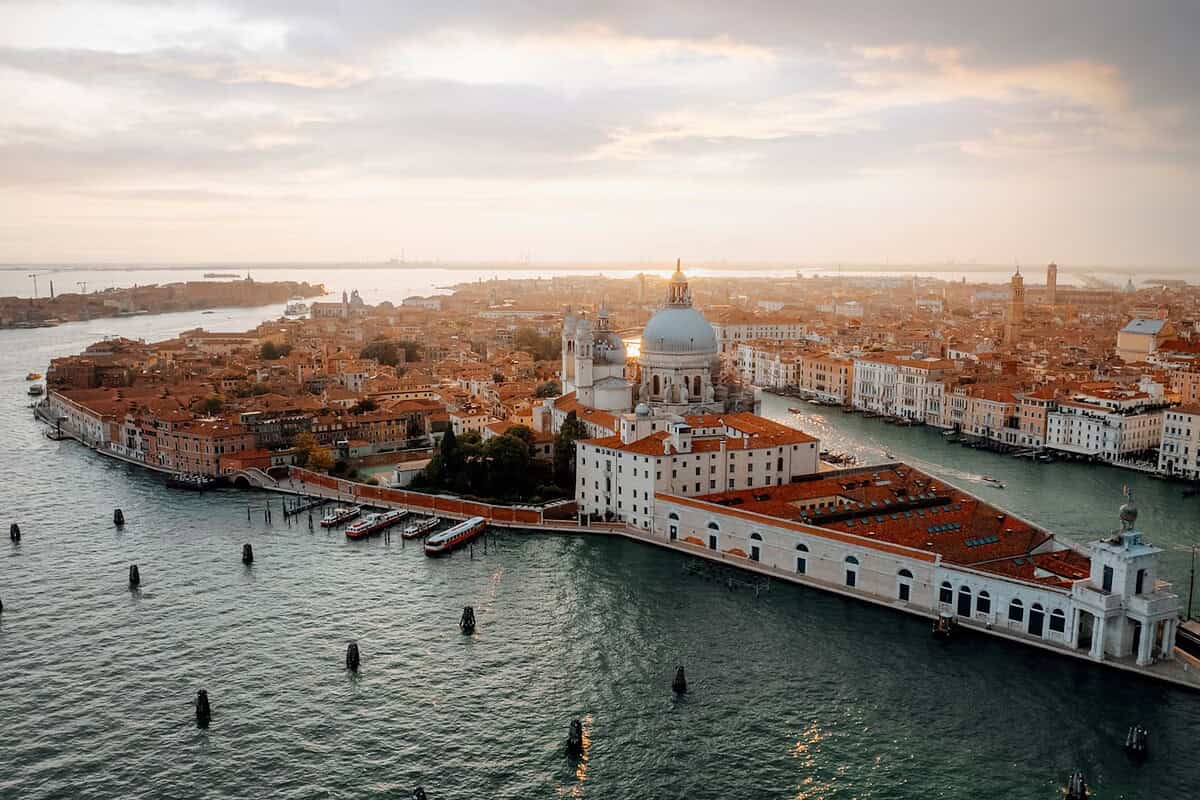 Venice tours white and brown dome building near body of water during daytime