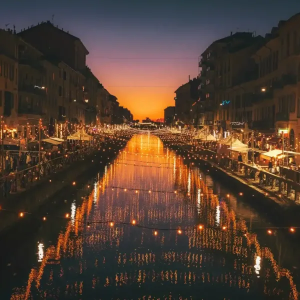 Milan Travel Guide reflective photography of string lights above river