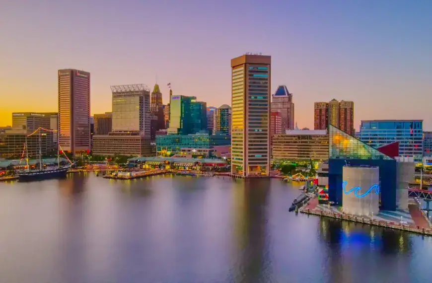 Baltimore Travel Guide city skyline across body of water during daytime